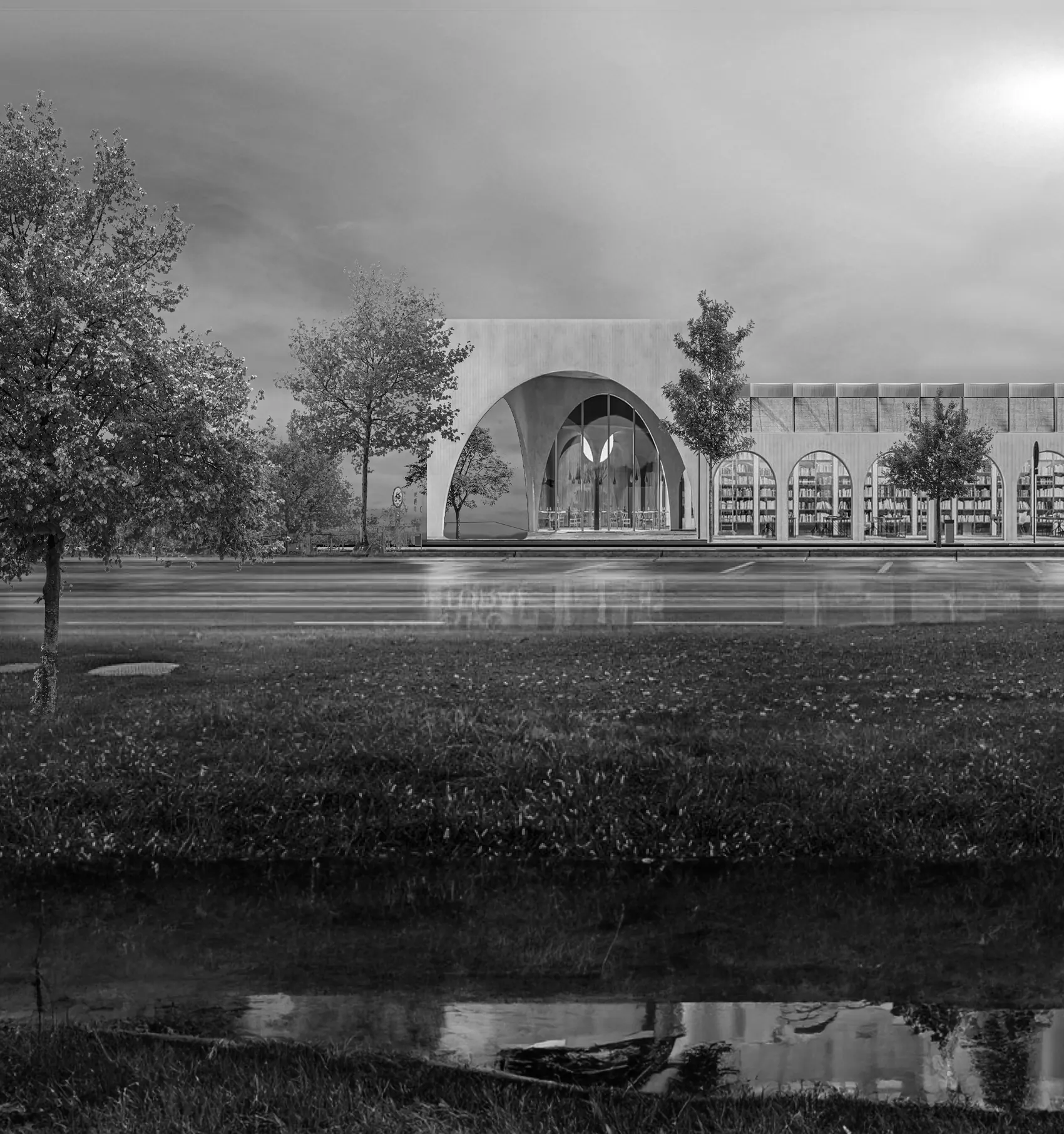 The centre seen across water from the park, in black and white.