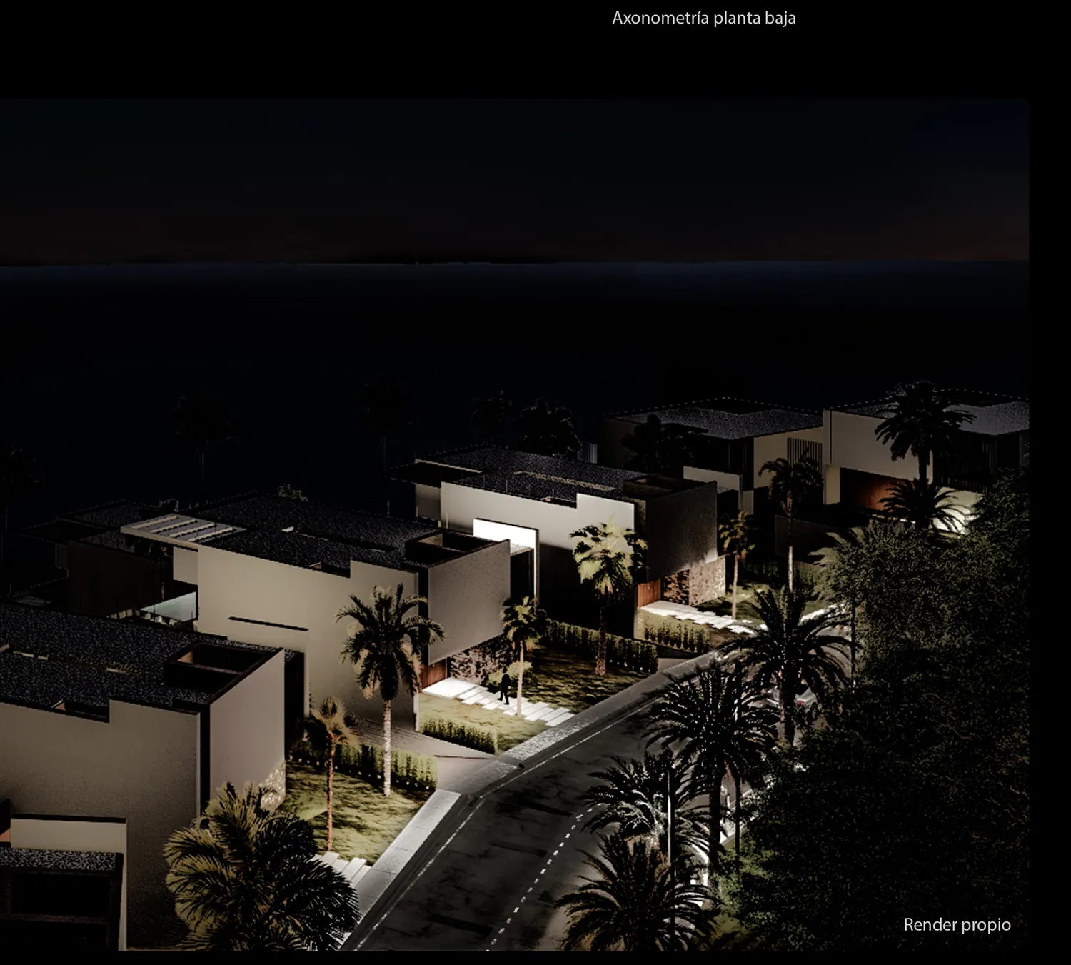 The development at night, stepped down the hillside toward the strait.